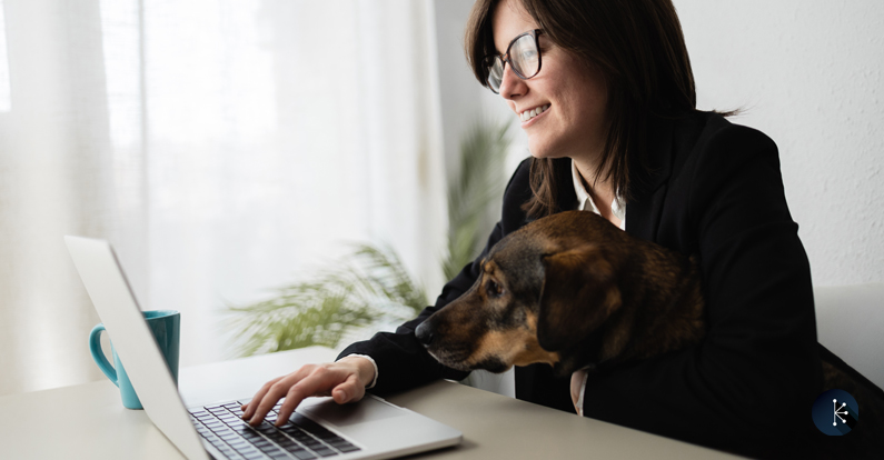 Mariner-Cybersecurity-Blog-Header-Happy-business-woman-working-in-computer-laptop-with-her-dog-at-modern-office-focus-on-face.jpg