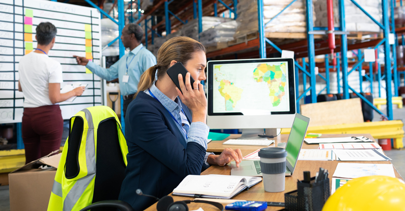 Mariner - Supply Chain Cybersecurity - Logistics manager talking on mobile phone at desk